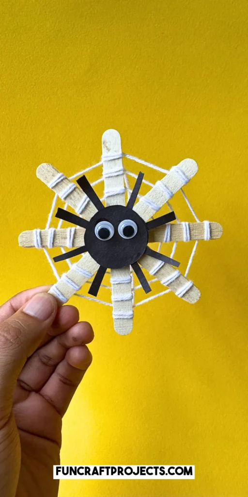 This DIY popsicle stick spider web craft is a fun preschool Halloween crat for kids. Made using 3 simple supplies, perfect for Halloween spider activities.