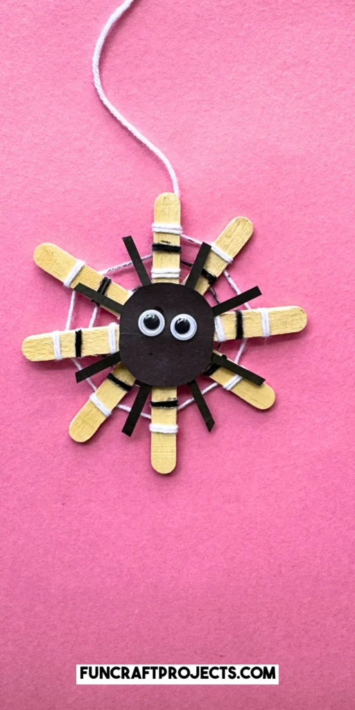 This DIY popsicle stick spider web craft is a fun preschool Halloween crat for kids. Made using 3 simple supplies, perfect for Halloween spider activities.