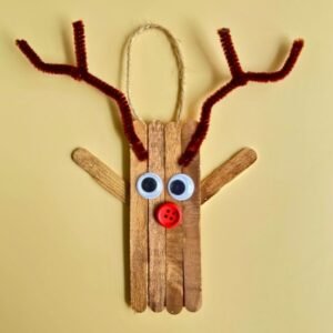 This cute DIY Popsicle Stick Reindeer Ornament craft is perfect for kids of all ages. Rudolph ornament is the perfect DIY Christmas Tree ornament.