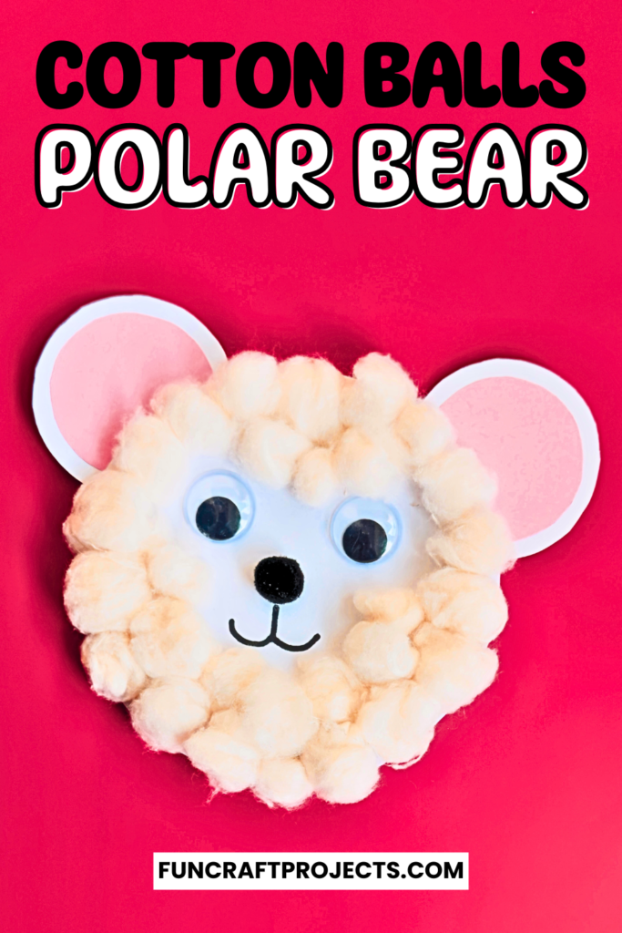 A cute cotton ball polar bear craft, white paper, and black and orange construction paper details.