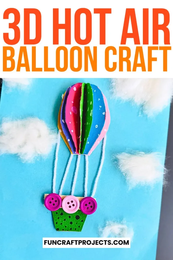 Bright and colorful construction paper hot air balloon craft with 3D effects, buttons for a basket, and fluffy cotton clouds on a blue background