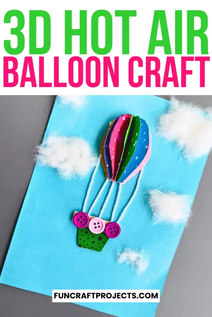 Bright and colorful construction paper hot air balloon craft with 3D effects, buttons for a basket, and fluffy cotton clouds on a blue background